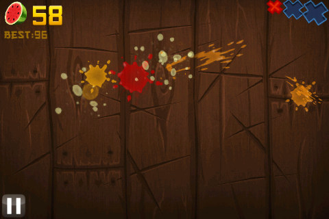 Fruit Ninja (iPhone) screenshot: Fruit splatter will remain on-screen after you cut fruit