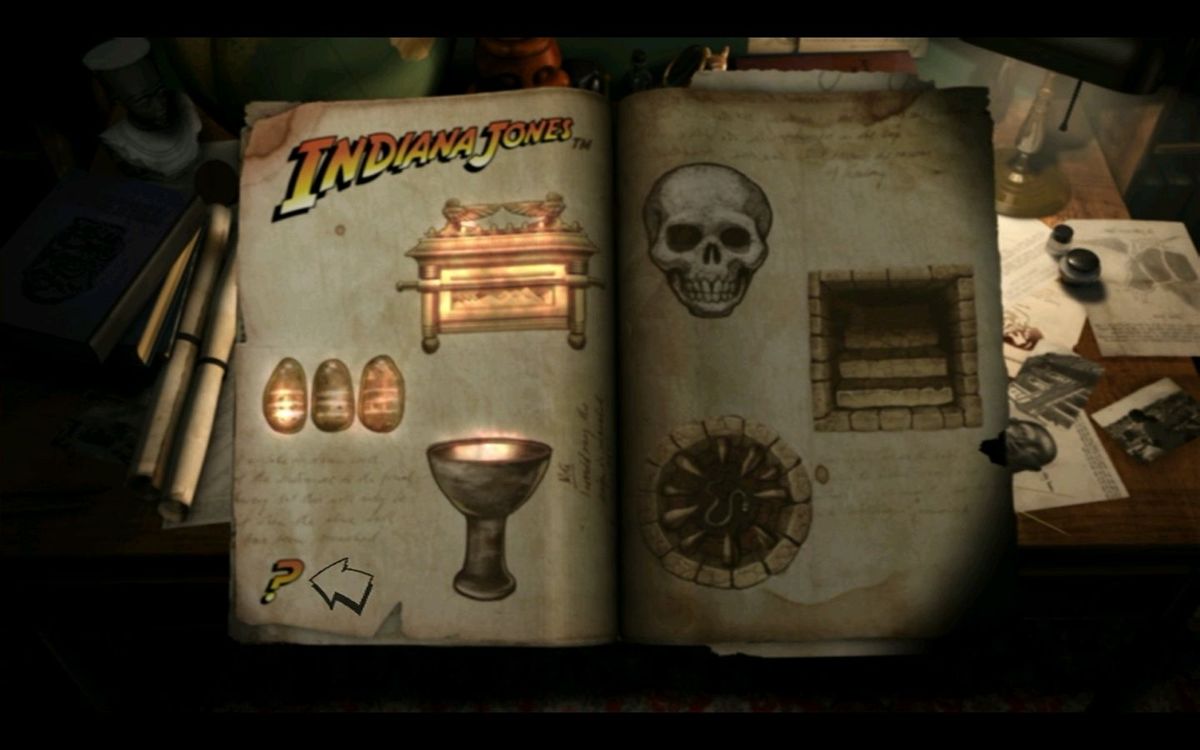 Indiana Jones: DVD Adventure Game (DVD Player) screenshot: The Game Menu: The items on the left, currently illuminated, are the three relics while on the right are the icons for Combat, Secret Passage and Trap