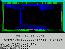 Necris Dome (ZX Spectrum) screenshot: The game starts with the player sneaking aboard in a coffin.