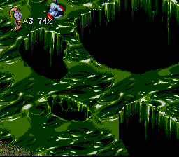 Earthworm Jim 2 (SNES) screenshot: Flying over a swamp