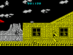 Desperado 2 (ZX Spectrum) screenshot: The baddie who could not be shot has just jumped out and shot me in the back. He can only be shot when he jumps out like this. It was the guy on the roof who killed me though