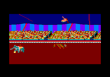 Fiendish Freddy's Big Top O' Fun (Amstrad CPC) screenshot: Soaring through the air