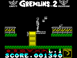 Gremlins 2: The New Batch (ZX Spectrum) screenshot: Moving on - on top of a filing cabinet. The drawers move in & out to make steps and this is a bridge to the next gantry