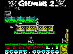 Gremlins 2: The New Batch (ZX Spectrum) screenshot: Bonus item retrieved, though it costs a life. Now the character seems to be shooting cherries or hearts at them