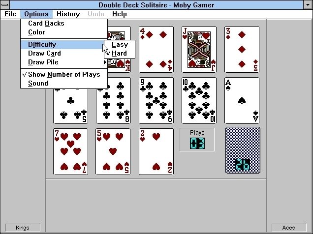 Double Deck Solitaire (Windows 16-bit) screenshot: Here the cards have just been dealt. The aces will move to the right and the kings to the left. This also shows some of the game configuration options