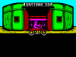 Days of Thunder (ZX Spectrum) screenshot: The game starts with the Daytona race. Here is the driver pulling up at the garage / pit stop