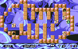 Stone Age (Commodore 64) screenshot: Pressing fire lets you control a white square to move plates you're not standing on.