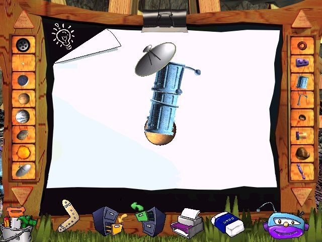 Junkyard Adventures in Space (Windows) screenshot: The Recycle Room: Look what I made Ma!<br>The light bulb in the corner of the picture area offers suggestions such as "What would a friendly alien look like?"