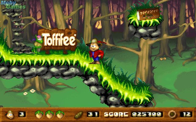 Toffifee: Fantasy Forest (DOS) screenshot: Hmm, advertisement in the woods.