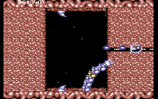 Life Force (Commodore 64) screenshot: Blasting through a solid wall