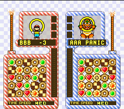 Yoshi's Cookie (SNES) screenshot: VS mode: Line-up the 5 cookies to clear them. Yoshi-cookies can be used as weapons against your opponents.