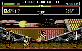 Street Fighter II (Commodore 64) screenshot: Ryu getting hit by Dhalsim's Yoga Flame