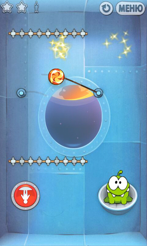 Cut the Rope (Android) screenshot: The cosmic box introduces buttons that change gravity