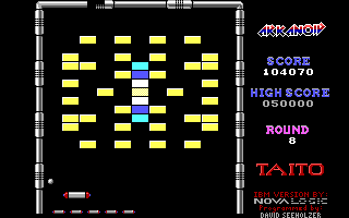 Arkanoid (DOS) screenshot: Round 8 requires some tricky bouncing to get the ball into the center where the destroyable bricks are (EGA)