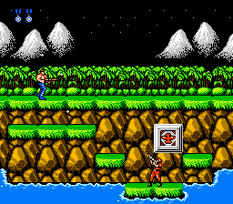 Contra (NES) screenshot: Destroy those square things -sometimes they drop items that will power-up your weapon