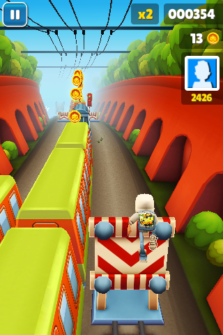 Subway Surfers (iPhone) screenshot: Jumping over obstacles