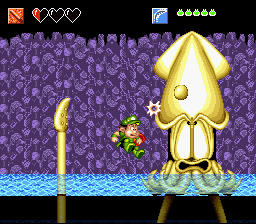 Super Adventure Island II (SNES) screenshot: Boss-fight against a large squid who has darkened the water with its ink