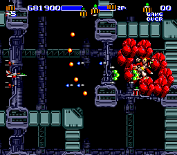 Air Buster (Genesis) screenshot: This guy is protected with the shield of red rocks of sorts