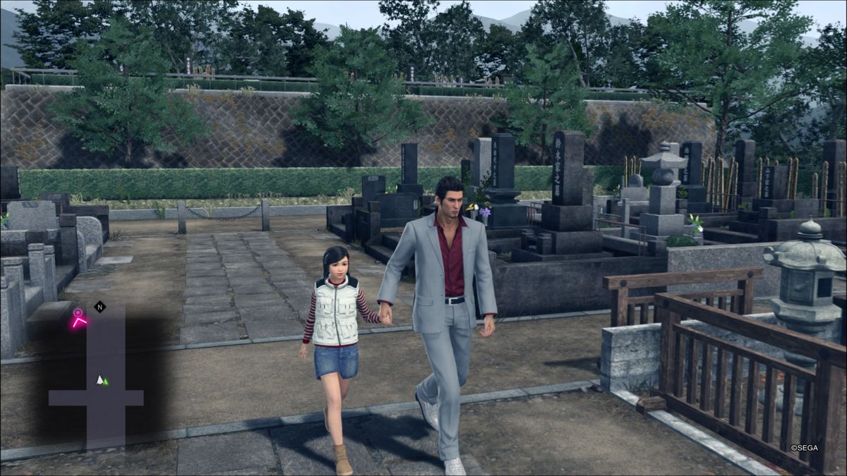 Yakuza: Kiwami 2 (PlayStation 4) screenshot: Kazuma and Haruka visiting graves of their loved ones