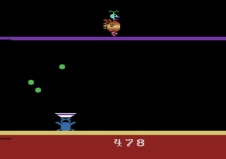 Eggomania (Atari 2600) screenshot: Egg yolk is collecting on the bottom of the screen