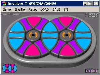 Revolver (Windows) screenshot: The start of a game. The screen says 'Puzzle Solved' until the pattern is disrupted by the player clicking on the 'Shuffle' option