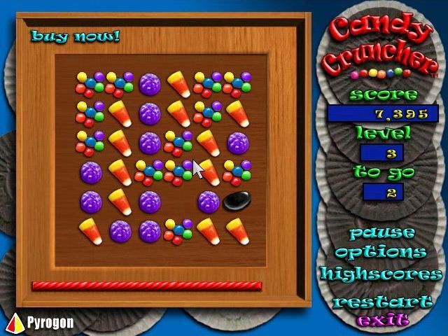 Candy Cruncher (Windows) screenshot: A game in progress. The black jelly bean cannot be moved bythe player but it does drop down as rows beneath it are removed