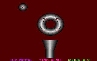 Icy Metal (DOS) screenshot: Game 1 in progress - a falling ball, a moving magnetic torus obstacle, player moveable funnel targe