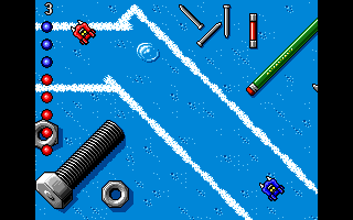 Micro Machines (DOS) screenshot: Bits 'n' pieces: glue, nails, pencils... all work well as obstacles.