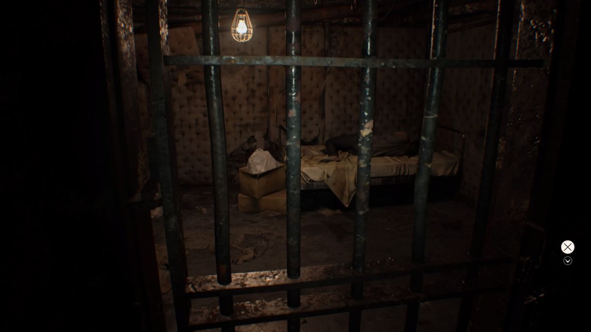 Resident Evil 7: Biohazard (PlayStation 4) screenshot: Is that Mia inside the cell... guess that's it, I found her and we can go home, end of the game