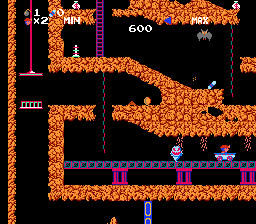 Spelunker (NES) screenshot: Ghost chases me, and I have to be careful.