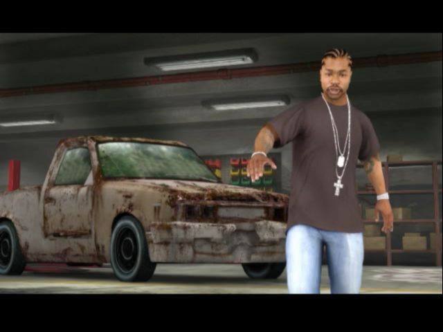 MTV Pimp My Ride (PlayStation 2) screenshot: Xzbit explains that the player is competing against other pimp shops