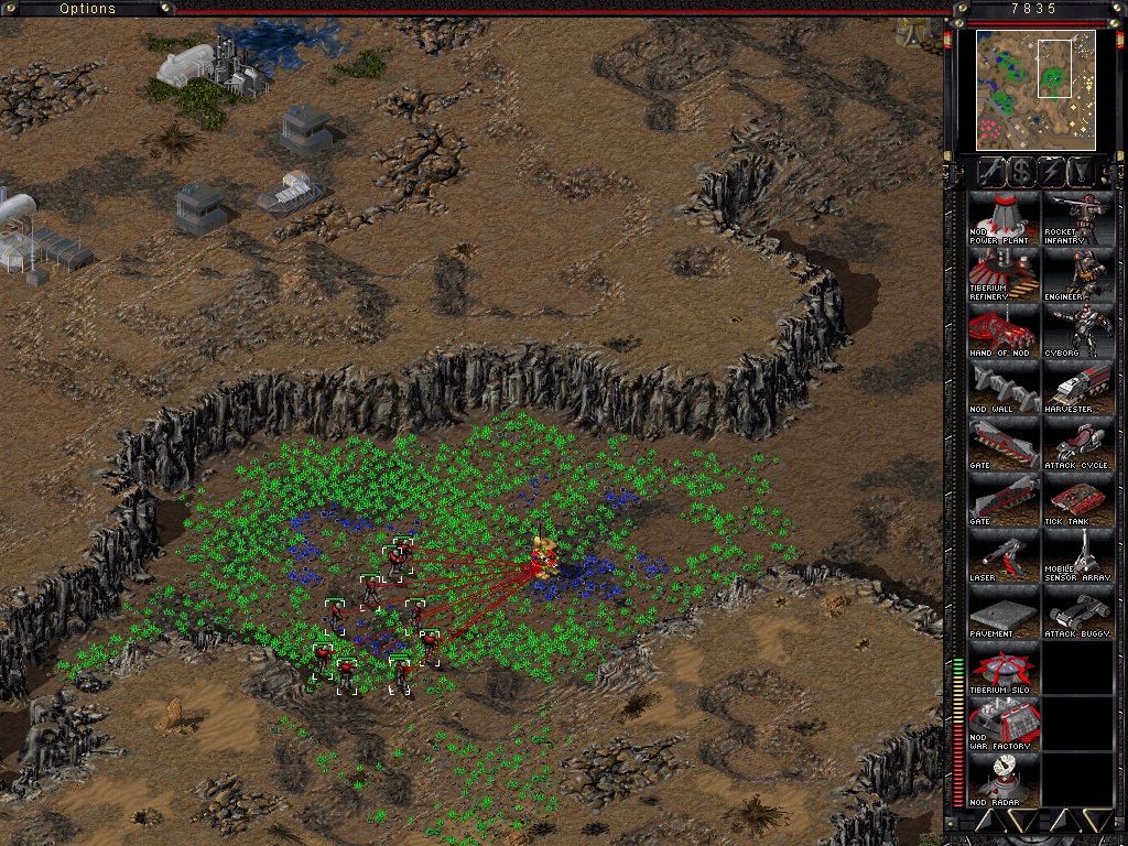 Command & Conquer: Tiberian Sun (Windows) screenshot: A group of Cyborgs are chasing a Titan. After the battle, you should leave the Cyborgs in a Tiberium field to regenerate health.