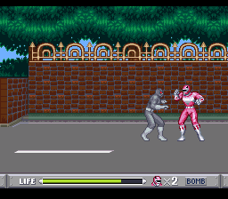 Mighty Morphin Power Rangers (SNES) screenshot: Fighting near a fence