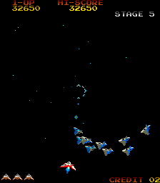 Gyruss (Arcade) screenshot: Enemy formation whizzing by
