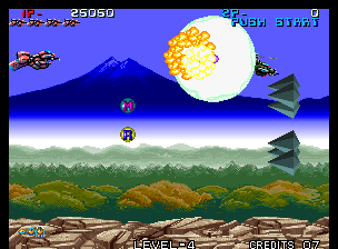 Zed Blade (Arcade) screenshot: Using a missile to wipe some enemies