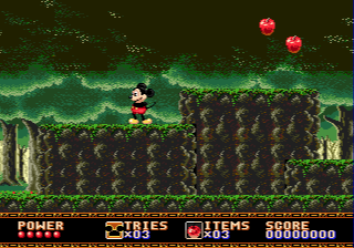 Castle of Illusion starring Mickey Mouse (Genesis) screenshot: Forest level. If you eat those apples, you can throw them at enemies afterwards