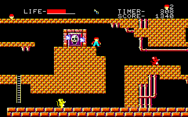 The Goonies (Sharp X1) screenshot: Stage 2, blowing up a skull door with a bomb