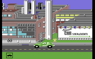 Hot Wheels (Commodore 64) screenshot: Driving through town.