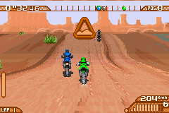 Moto Racer Advance (Game Boy Advance) screenshot: About to pass an opponent over a hill on the Kenya track.