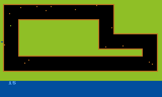 Dodge Racer (Atari 8-bit) screenshot: Version 1.1 adds an on-screen score counter and a lap finish line (the blue dot on the left)