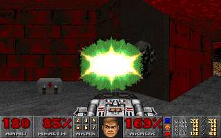 Doom (DOS) screenshot: Later in the game you'll gain some impressive-looking weapons with cool effects. Take this, you... you... face!..