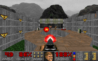 Doom (DOS) screenshot: Outdoor shootout during the first episode. Nice view, cool effects from enemy's rocket launcher... I knew I did the right thing when I booked this vacation