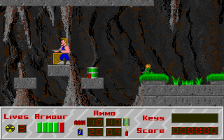 Mutant Earth (DOS) screenshot: The player can plant dynamite to blow up barrels and crates to get useful items.