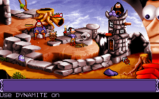 Goblins Quest 3 (DOS) screenshot: Wynnona is one of several characters that help Blount along his way. Here, Blount watches as his darling blasts a tower to pieces.