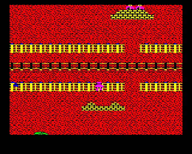 Who Dares Wins II (BBC Micro) screenshot: Crossing some railroad tracks.