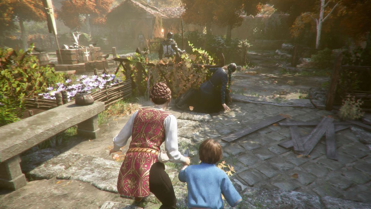 A Plague Tale: Innocence (Windows) screenshot: Sneaking past the guards. You hold Hugo by his hand most of the time, but it is also possible to release him.