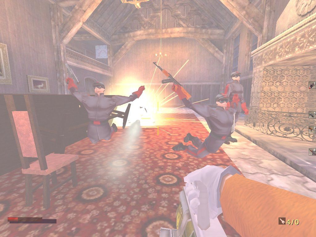 The Operative: No One Lives Forever (Windows) screenshot: Cate's handy dandy rocket launching briefcase sends a bunch of H.A.R.M. stormtroopers flying through the air
