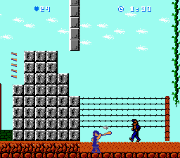 Bats & Terry (NES) screenshot: Playing as Terry on the first stage of World 2, if you time it right you can deflect the enemy projectiles with the bat