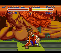 Super Street Fighter II (SNES) screenshot: Dee Jay's Machine Gun Uppercut forces Sagat to do a very closing defense position.