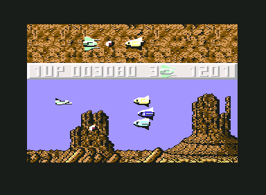 Sanxion (Commodore 64) screenshot: Head on with bullet shaped aliens.